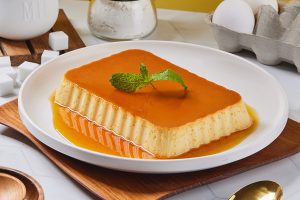 Traditional flan on a plate with a mint leaf